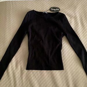 Black long sleeve sweater. Size S. New without tags.